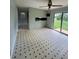 Bright living room with sliding glass doors to yard and ceiling fan at 6192 Meadowbrook Dr, Norcross, GA 30093