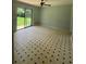 Bright living room with black and white tile flooring and sliding glass doors to the backyard at 6192 Meadowbrook Dr, Norcross, GA 30093