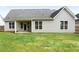 View of the back of the house, showing large windows and a covered patio area at 21 Spring Folly Nw, Cartersville, GA 30121