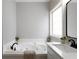 Bathroom features oversized tub, white vanity and black hardware at 21 Spring Folly Nw, Cartersville, GA 30121