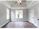 Spacious bedroom features hardwood floors, natural light, and a trey ceiling with a ceiling fan at 21 Spring Folly Nw, Cartersville, GA 30121