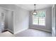 Neutral dining area featuring decorative lighting and natural light from windows at 21 Spring Folly Nw, Cartersville, GA 30121