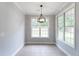 Neutral dining room featuring decorative lighting and multiple bright windows at 21 Spring Folly Nw, Cartersville, GA 30121
