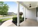 Covered front porch featuring white columns and landscaping, offering a welcoming outdoor space at 21 Spring Folly Nw, Cartersville, GA 30121