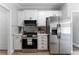 Beautiful neutral kitchen showcasing stainless steel appliances, cabinets, and hardware at 21 Spring Folly Nw, Cartersville, GA 30121