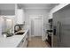 Bright kitchen with quartz countertop, stainless steel appliances, and white cabinets at 21 Spring Folly Nw, Cartersville, GA 30121