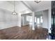 Open-concept living room with hardwood floors, modern lighting, and bright, neutral paint at 21 Spring Folly Nw, Cartersville, GA 30121