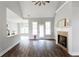 Open living space with fireplace, vaulted ceiling, hardwood floors, and natural light at 21 Spring Folly Nw, Cartersville, GA 30121