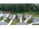 Birds-eye view of well-maintained homes with manicured lawns and long driveways in a desirable neighborhood at 5090 Bellehurst Ln, Cumming, GA 30040