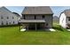 Spacious backyard with lush lawn, featuring a covered patio perfect for outdoor living at 5090 Bellehurst Ln, Cumming, GA 30040