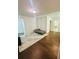Bedroom with hardwood floors, a futon and a patterned rug at 5090 Bellehurst Ln, Cumming, GA 30040