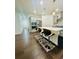 Open-concept kitchen with counter seating, stainless steel appliances, recessed lighting, and hardwood floors at 5090 Bellehurst Ln, Cumming, GA 30040