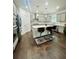 Modern kitchen featuring stainless steel appliances, a center island, and hardwood floors and recessed lighting at 5090 Bellehurst Ln, Cumming, GA 30040