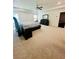 Large main bedroom featuring carpeted floors, a ceiling fan, and ample space at 5090 Bellehurst Ln, Cumming, GA 30040