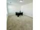 Minimalist office space featuring neutral walls and carpeting, complete with a sleek black desk at 5090 Bellehurst Ln, Cumming, GA 30040