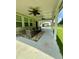 Covered outdoor patio with ceiling fans and comfortable seating for relaxing or entertaining at 5090 Bellehurst Ln, Cumming, GA 30040