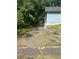Driveway leading toward the home with a wooded area on the right at 702 Emily Pl # 0, Atlanta, GA 30318