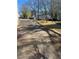 Long driveway with trees overhead and a trailer in the background at 702 Emily Pl # 0, Atlanta, GA 30318