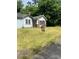 Exterior of a light blue home with a covered front porch and manicured front lawn at 702 Emily Pl # 0, Atlanta, GA 30318