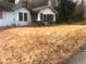 Exterior of light blue home with a covered front porch and large front yard at 702 Emily Pl # 0, Atlanta, GA 30318