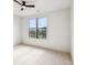 Bright bedroom featuring large window and neutral carpeting at 799 Hammond Dr # 325, Atlanta, GA 30328
