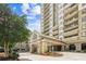 The entrance to the building has a covered entrance and beautifully maintained landscaping at 799 Hammond Dr # 325, Atlanta, GA 30328