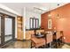 Contemporary dining area with a sleek table, comfortable seating, and a stylish bar with storage at 799 Hammond Dr # 325, Atlanta, GA 30328
