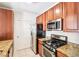 Well-equipped kitchen with stainless steel appliances, granite countertops, and ample cabinet space at 799 Hammond Dr # 325, Atlanta, GA 30328