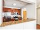 Well-lit kitchen features stainless steel appliances, granite countertops, and ample cabinet space at 799 Hammond Dr # 325, Atlanta, GA 30328