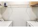 Laundry room with washing machines and overhead shelving at 799 Hammond Dr # 325, Atlanta, GA 30328