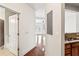 Open concept living room and kitchen with an island, hardwood floors and white walls at 799 Hammond Dr # 325, Atlanta, GA 30328