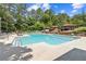 Inviting pool with sun loungers and shaded cabanas, perfect for relaxation and enjoying the outdoors at 799 Hammond Dr # 325, Atlanta, GA 30328