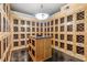 Spacious wine cellar featuring individual storage cabinets and a central island for organization at 799 Hammond Dr # 325, Atlanta, GA 30328