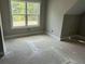 Bedroom features large window with backyard views at 99 Mountain Brook Dr, Cumming, GA 30041