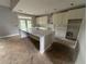 Spacious kitchen with a large marble island, modern cabinets, and a door to the outside at 99 Mountain Brook Dr, Cumming, GA 30041