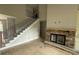 Elegant staircase with iron railings leading to the upper level of the house at 99 Mountain Brook Dr, Cumming, GA 30041