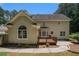Home exterior featuring a wooden deck and large windows to view backyard at 100 Hamilton Glen Ct, Fayetteville, GA 30215