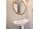 Bathroom featuring a pedestal sink, mirror, and neutral wall color at 100 Hamilton Glen Ct, Fayetteville, GA 30215
