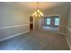 Classic dining room featuring a chandelier and views to another room at 100 Hamilton Glen Ct, Fayetteville, GA 30215