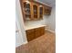 Butler's pantry features wood cabinets, counter space and tile flooring at 100 Hamilton Glen Ct, Fayetteville, GA 30215