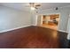 Living room with hardwood floors and a view into the kitchen at 100 Hamilton Glen Ct, Fayetteville, GA 30215