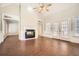 Living room featuring a fireplace and large windows providing natural light at 100 Hamilton Glen Ct, Fayetteville, GA 30215