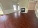 Living room with fireplace, hardwood floors and neutral walls at 100 Hamilton Glen Ct, Fayetteville, GA 30215