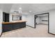 Finished basement with a bar area and doorway leading to another room at 1045 River Pt, Suwanee, GA 30024