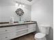 Stylish bathroom featuring a unique glass bowl sink, decorative mirror, and tiled floor at 1045 River Pt, Suwanee, GA 30024