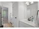 Bright bathroom with single vanity, white cabinets, and tile floors at 1045 River Pt, Suwanee, GA 30024