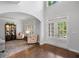 Inviting entryway features arched doorway, hardwood floors, and lots of natural light at 1045 River Pt, Suwanee, GA 30024