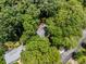 Aerial view of the home nestled in the trees of the community at 2240 Six Branches Dr, Roswell, GA 30076
