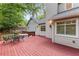 View of the back deck with a table and chairs next to the rear exterior at 2240 Six Branches Dr, Roswell, GA 30076