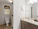 A cozy bathroom with a view, featuring natural light, stylish fixtures, and a well-maintained vanity at 2240 Six Branches Dr, Roswell, GA 30076